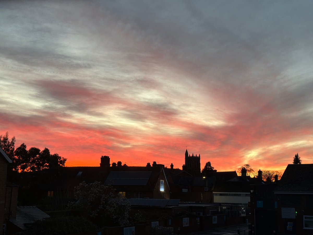 Sunset captured over Malvern Hills townscape with vibrant colors