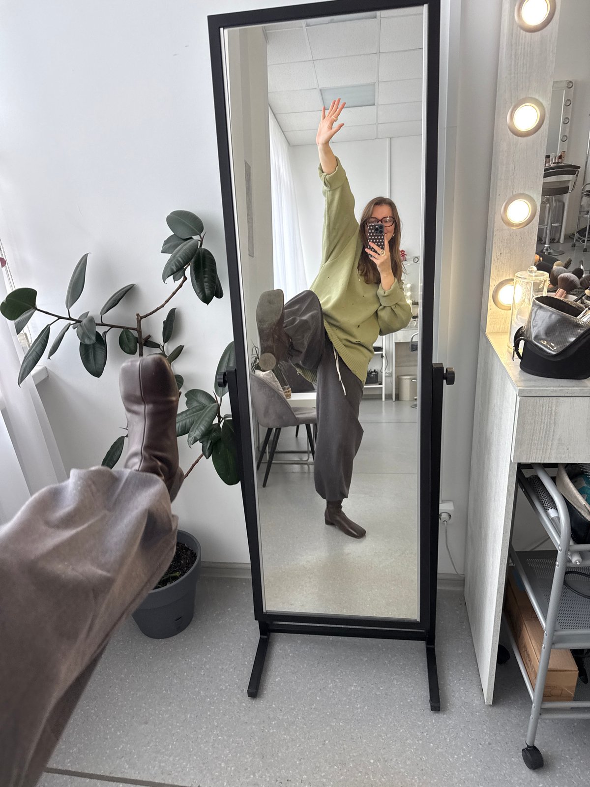 Masked person takes mirror selfie in Izhevsk apartment