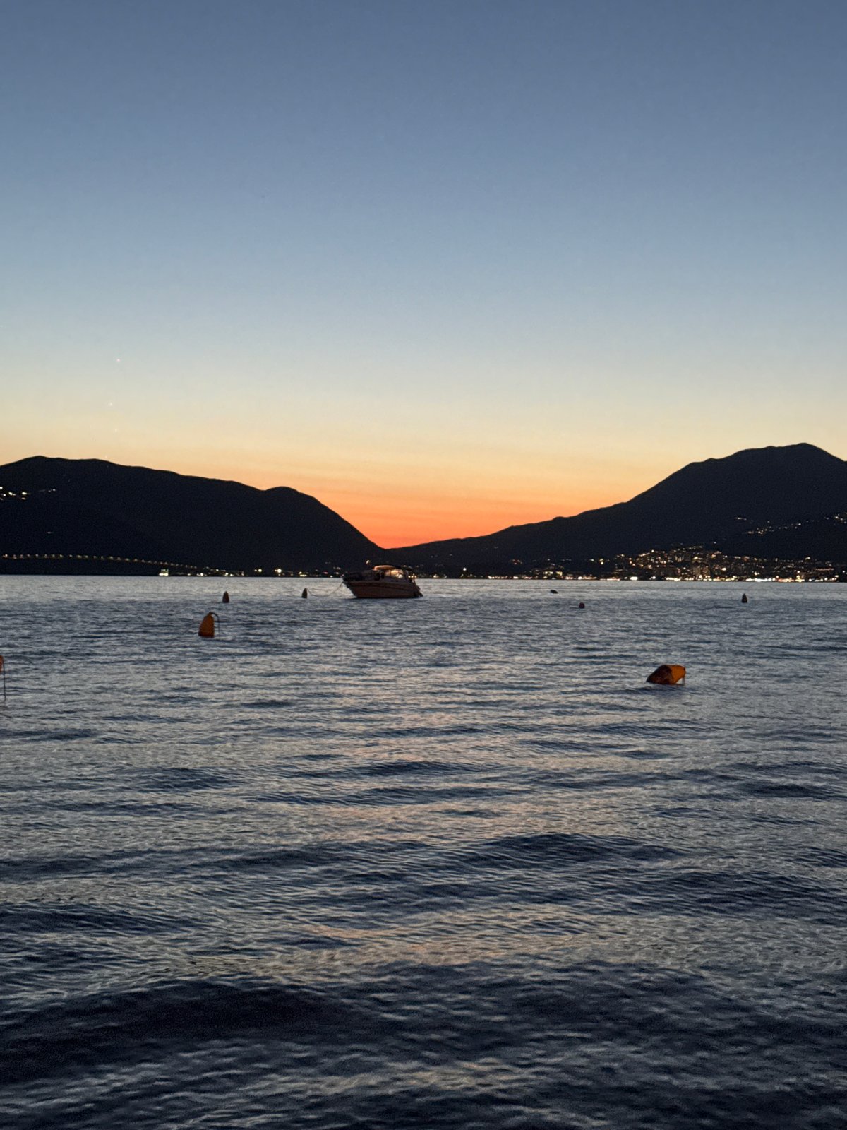 Dusk on the bay, mountains silhouetted, golden hour winding down