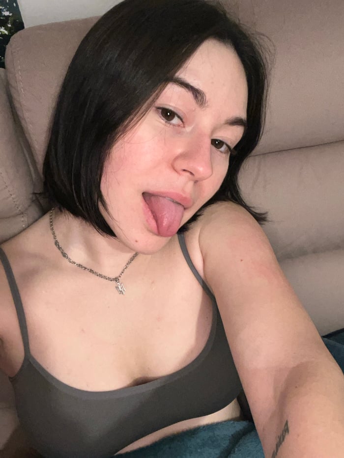 Woman photographed in casual evening moments on couch in Montenegro
