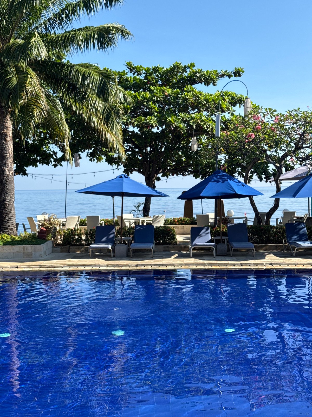 Poolside scene captured at Buleleng resort during early morning hours