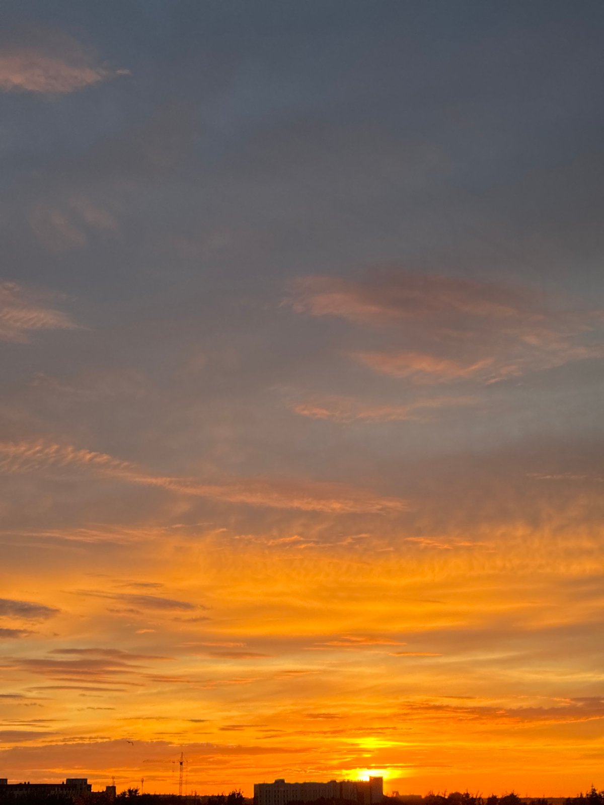 City sunset tracked across 90 minutes, clouds and color the whole way