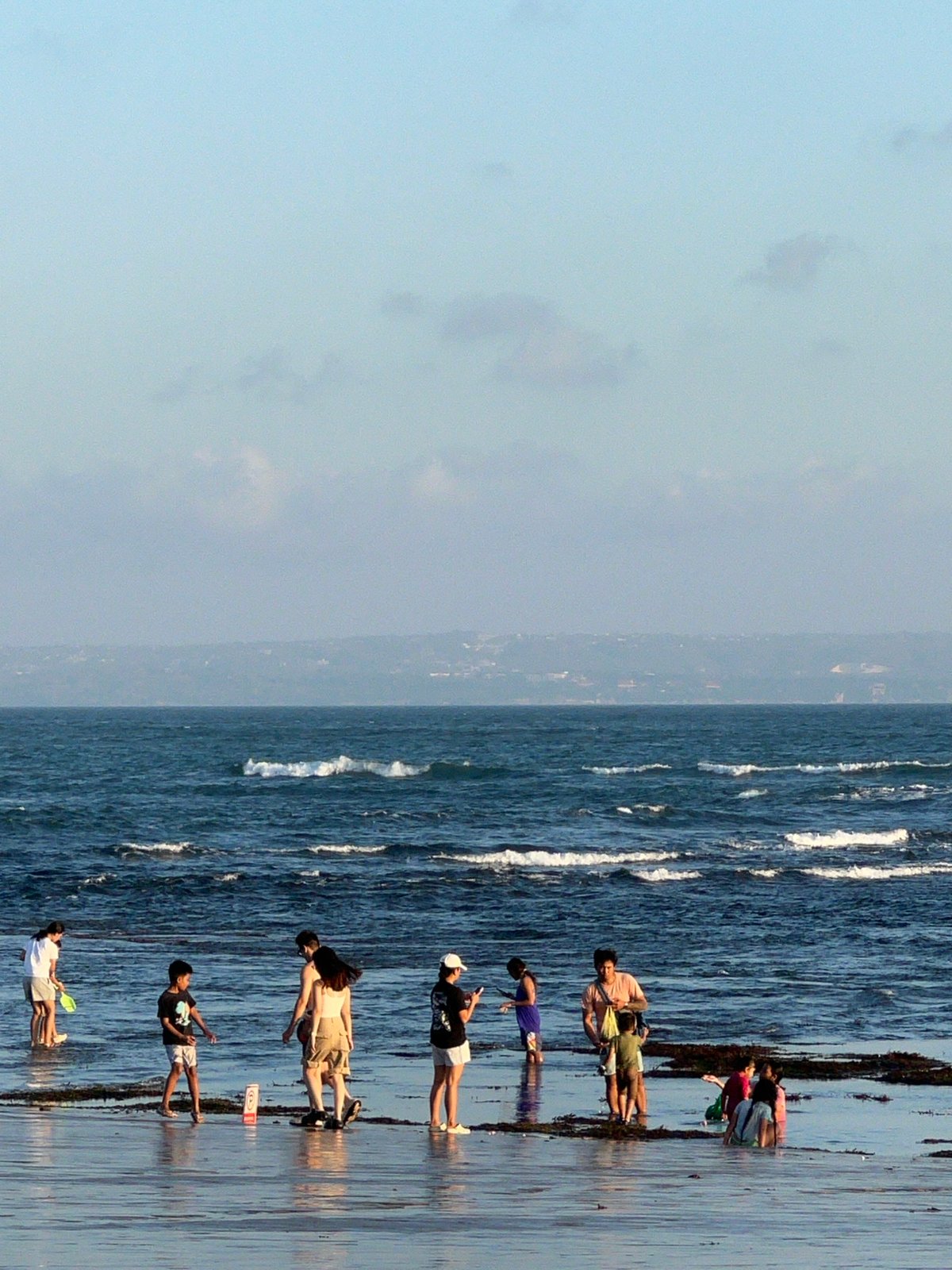 Sunset crowd fills North Kuta beach with soccer and shoreline life