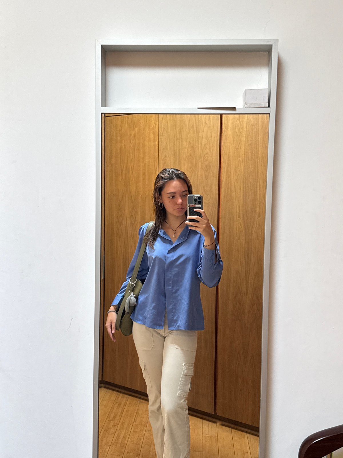 Woman takes mirror selfie in Mexican home