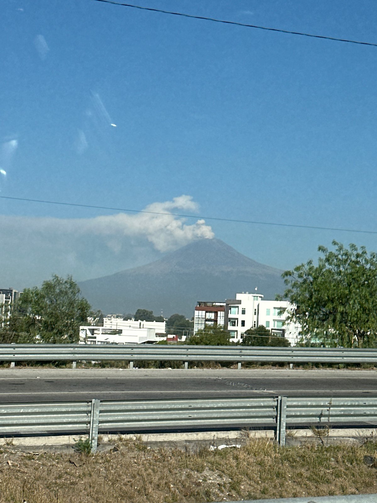 Highway scene with mountain backdrop observed in Mexico