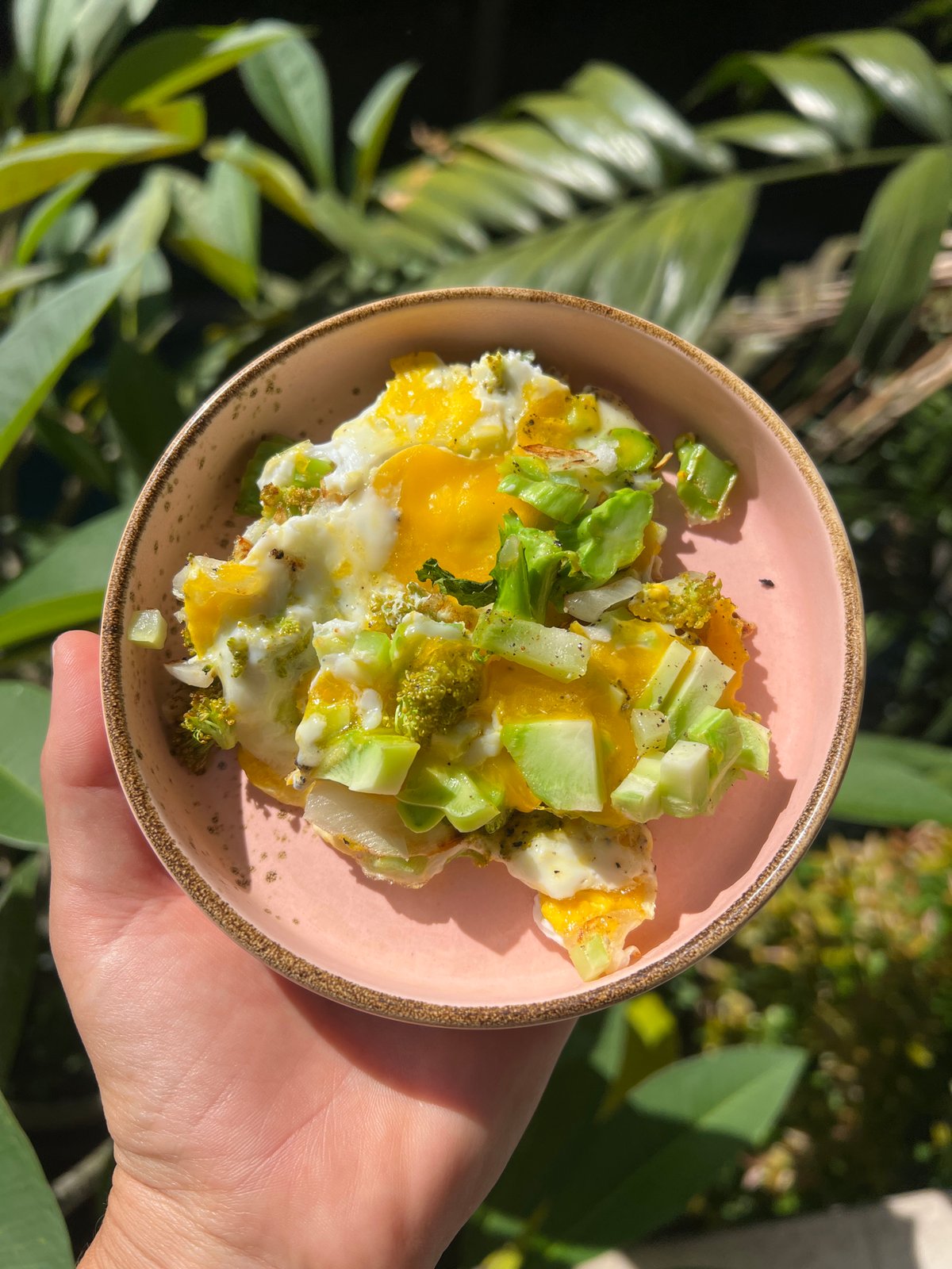 Egg dish with green vegetables served in Ubud, Indonesia