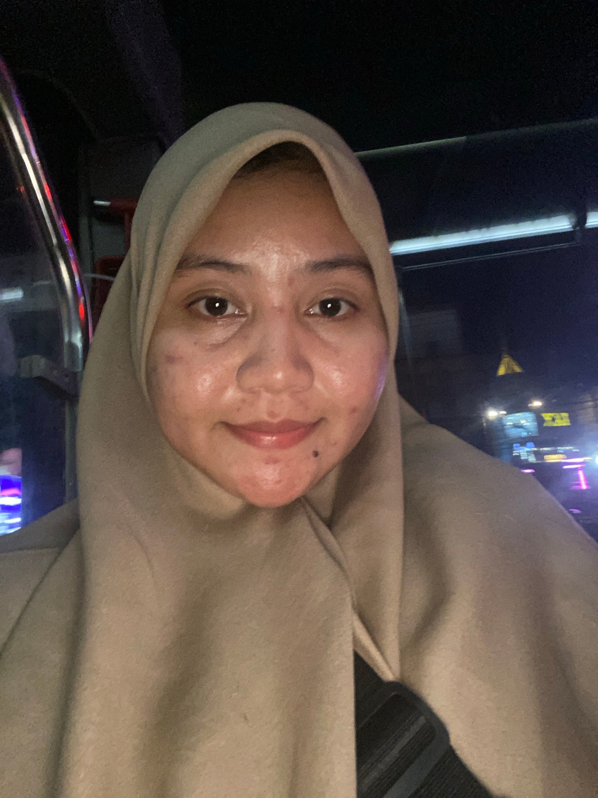 On a Banjarmasin city bus heading toward RSUD Ulin at night