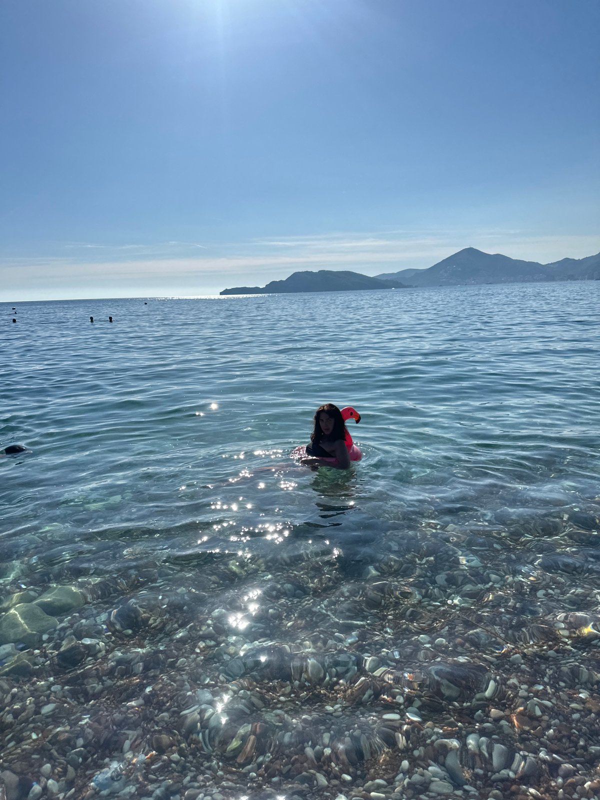 Summer beach day draws visitors to Montenegro's Sveti Stefan
