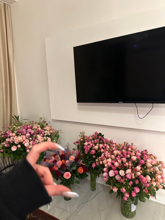 Woman Takes Selfie in Yerevan Flower Shop