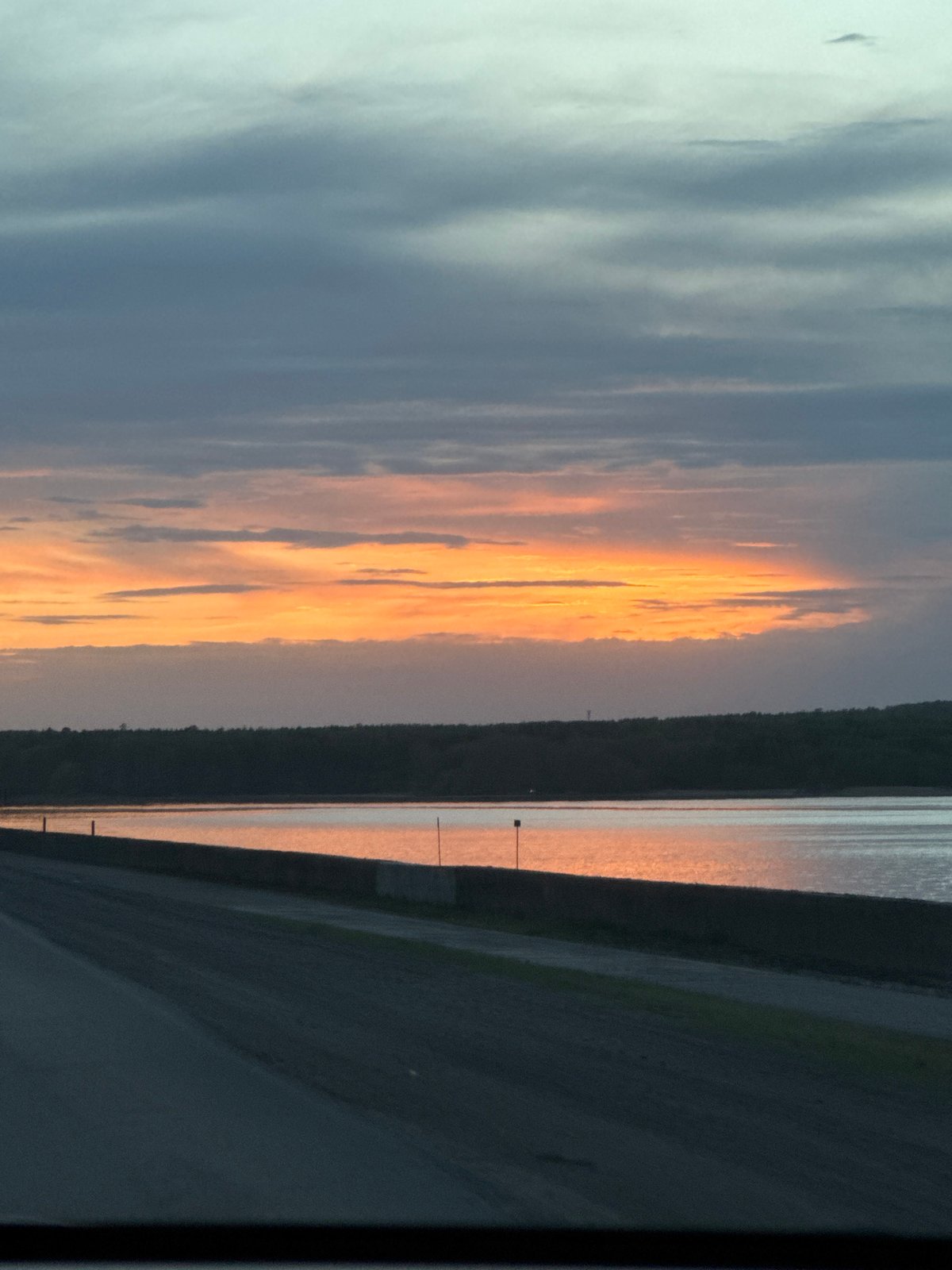 Sunset observed over water body in Chaikovsky, Russia