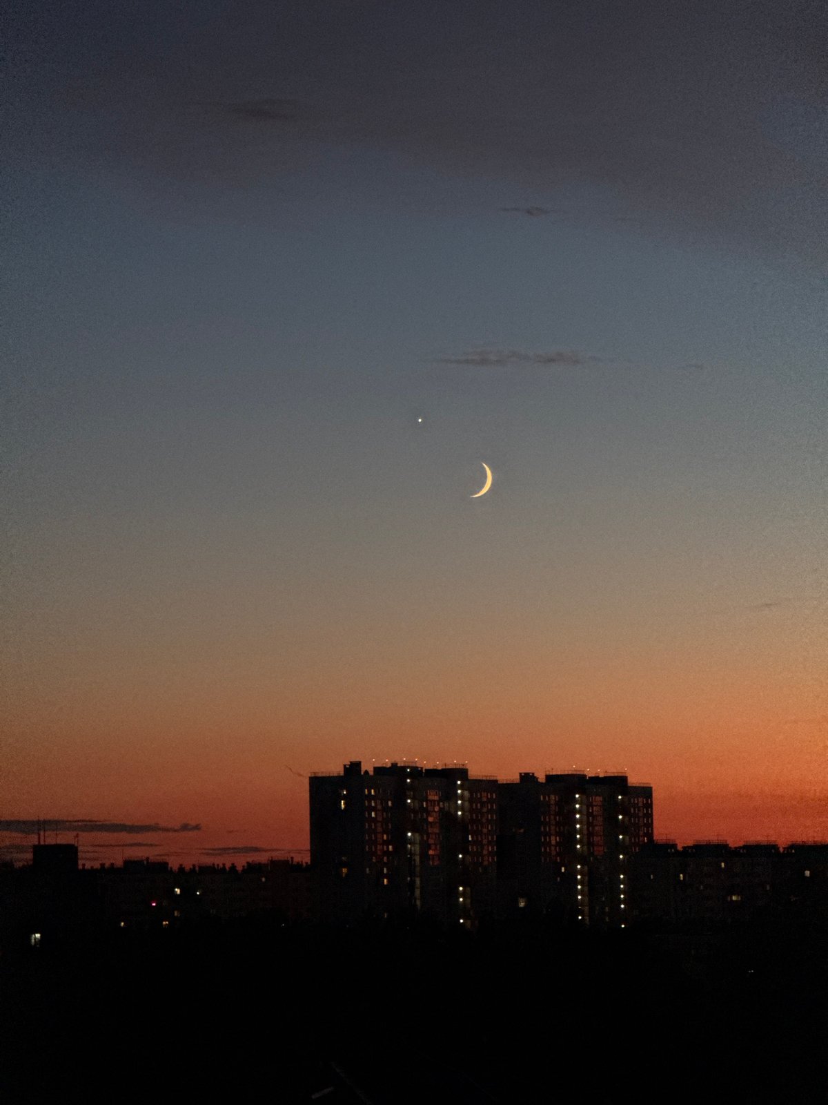 Crescent moon and Venus rise over Nizhny Novgorod at dusk