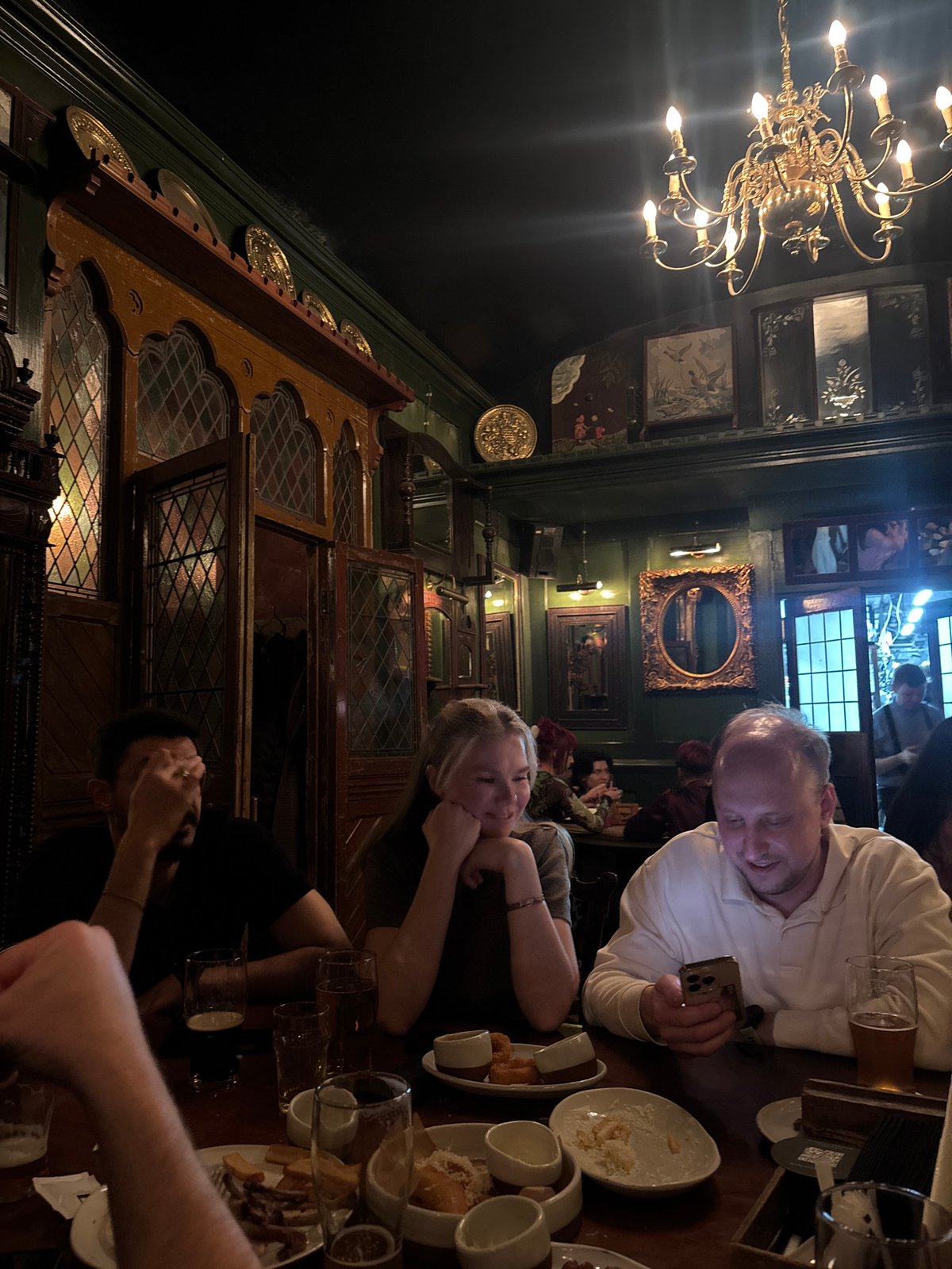 Witness captures ornate pub interior with chandelier, dark décor