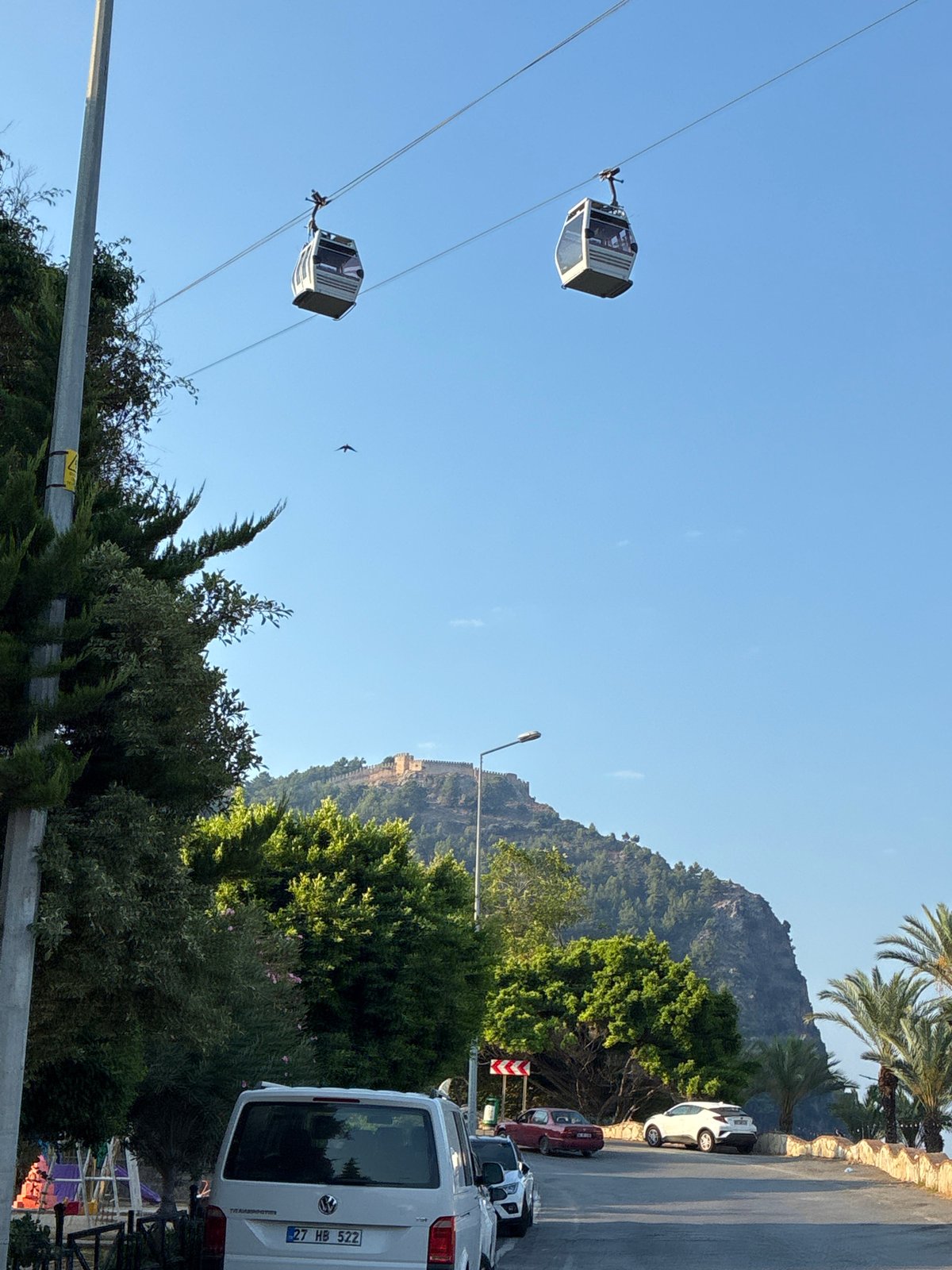 Morning views from Alanya's hilltop: cable cars, coastline, and old city