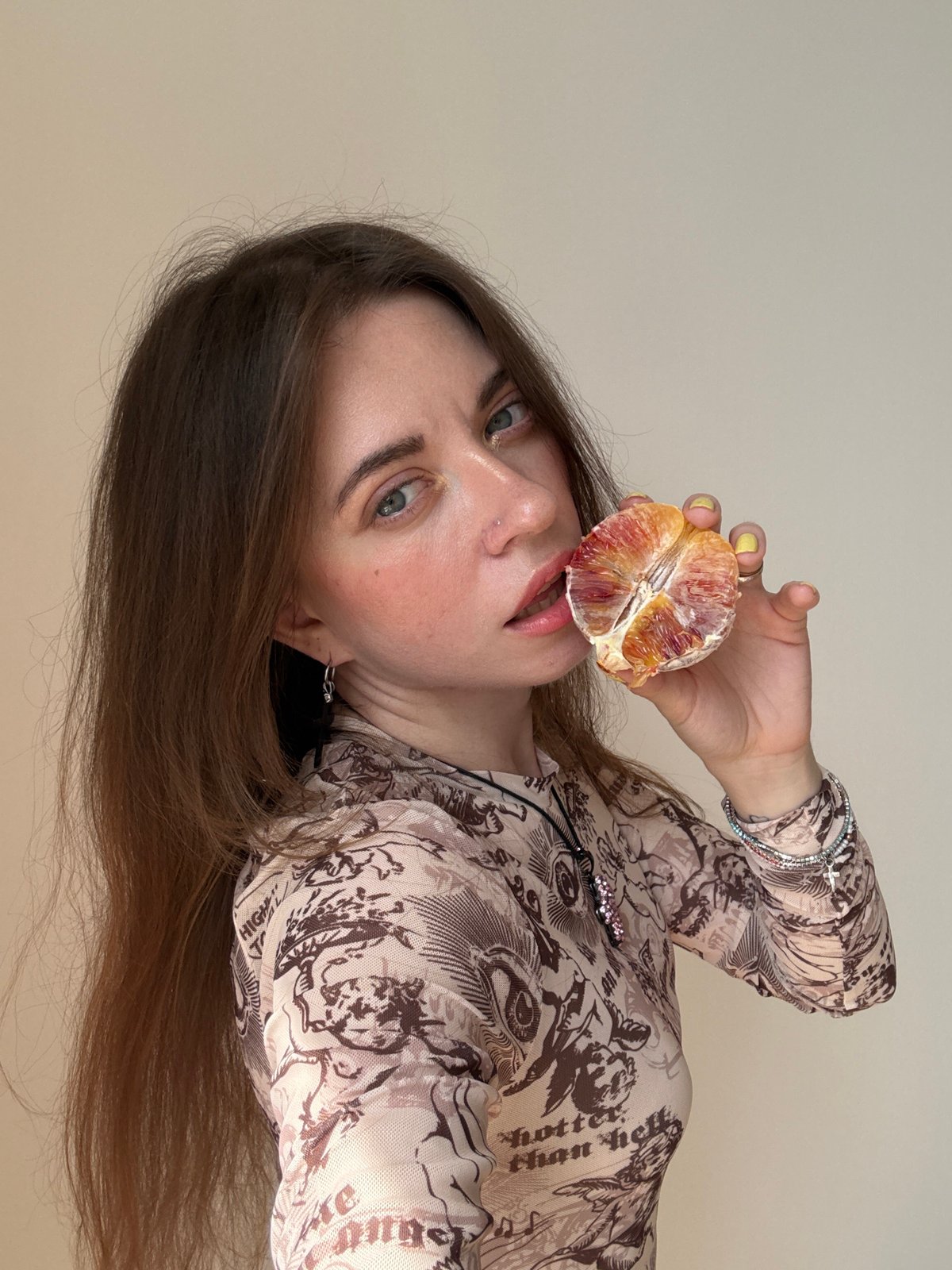 Woman poses with blood orange in Moscow photo session