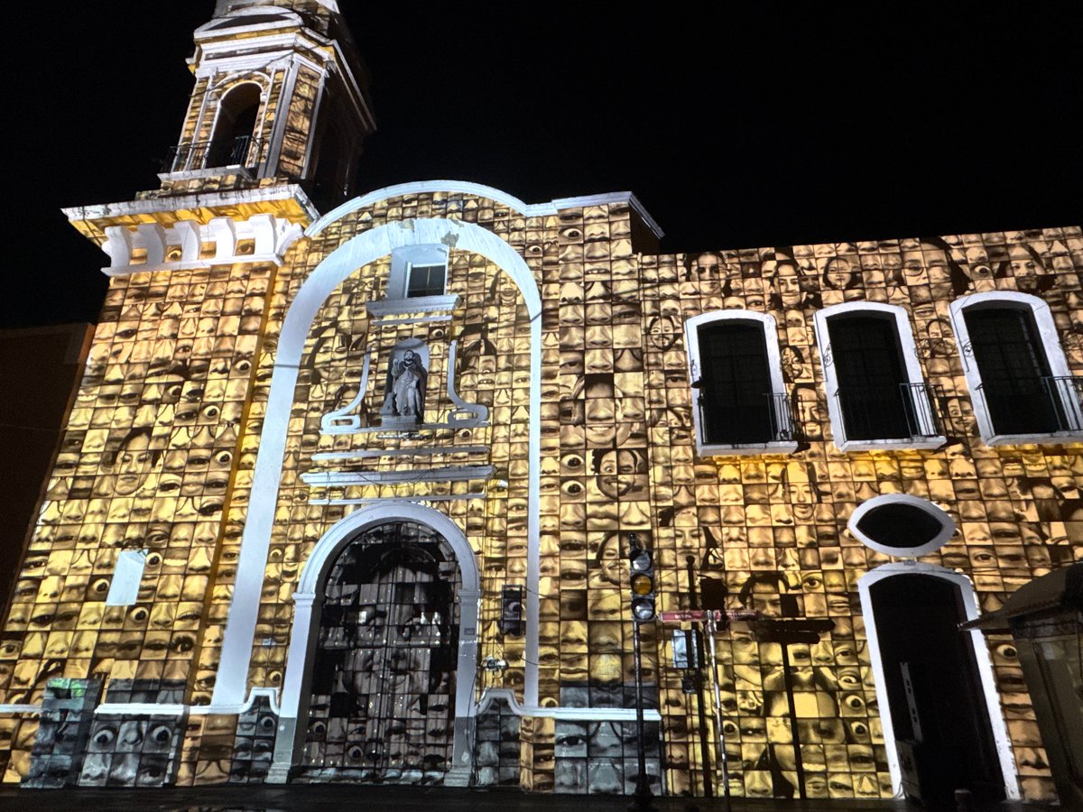 Church in Puebla illuminated with projected faces display