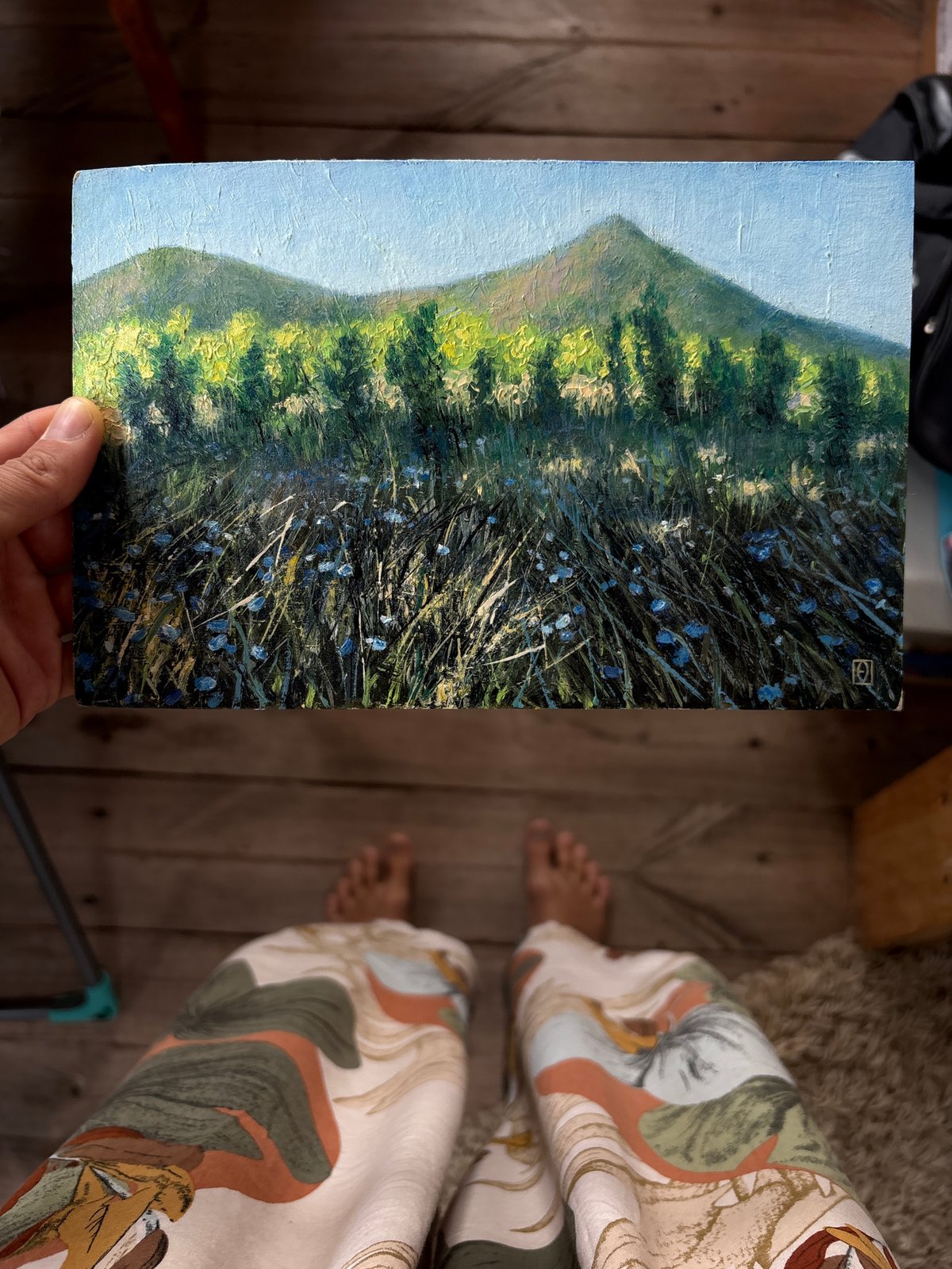 Person displays landscape painting in Ulyanovsk, Russia