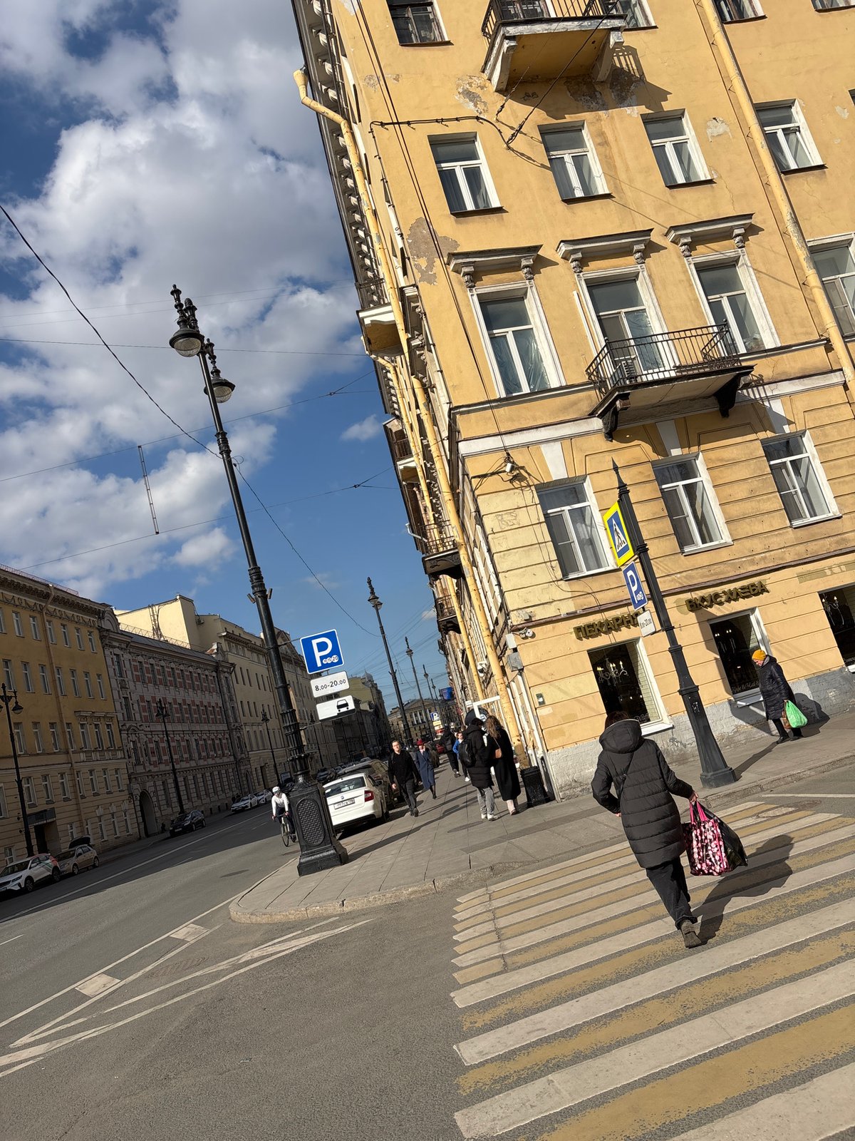 Tourist documents central Saint Petersburg landmarks during morning walkabout