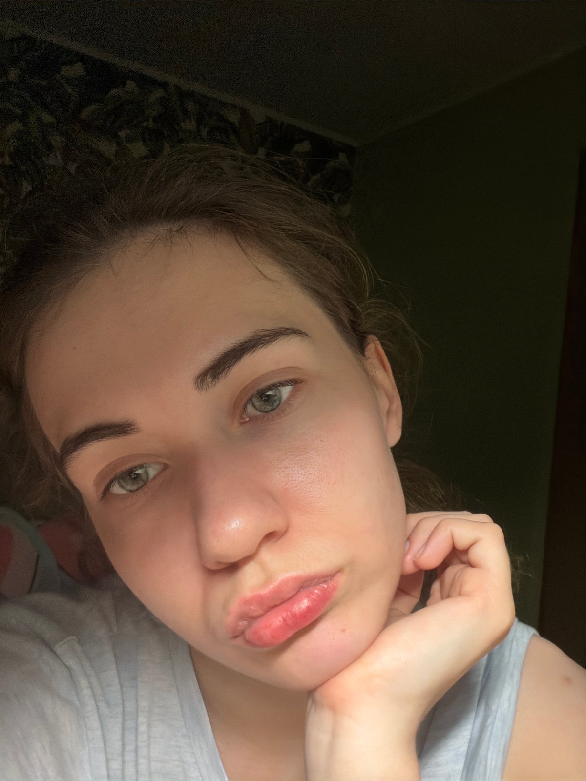 Selfie session at home in Zavodoukovsk, with a movie playing nearby.