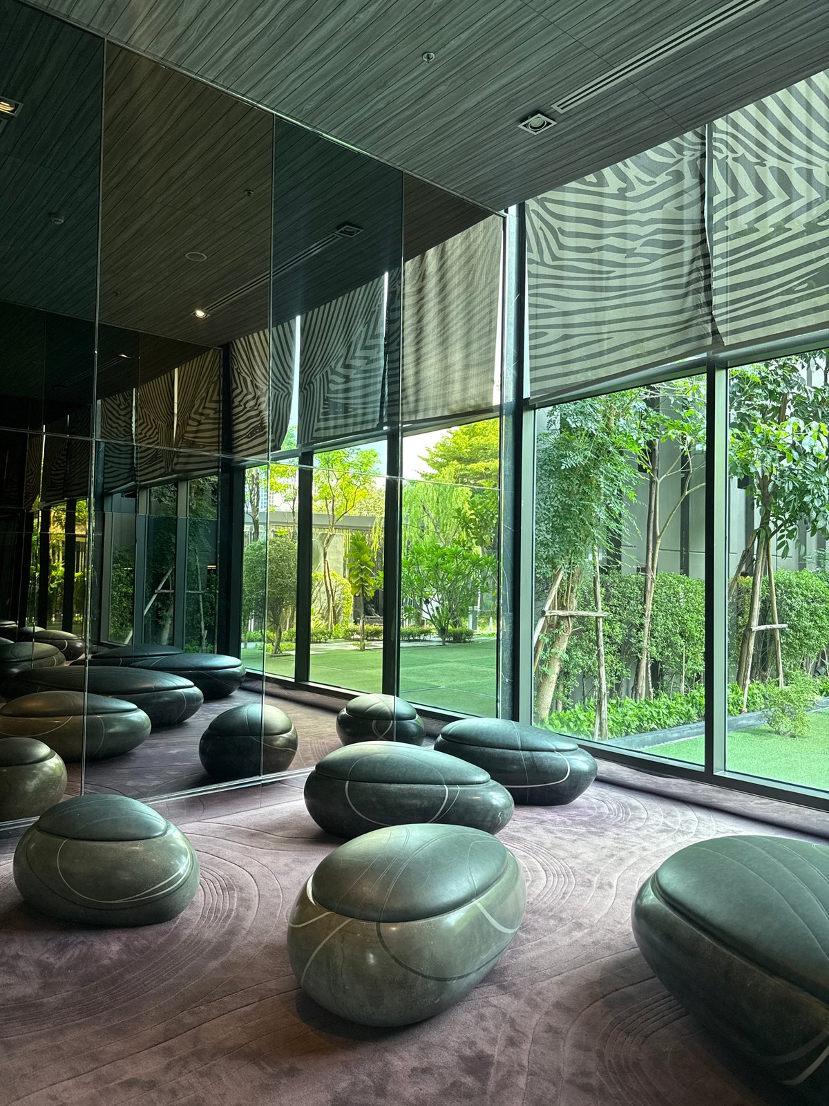 Modern Bangkok building interior features distinctive gray spherical objects