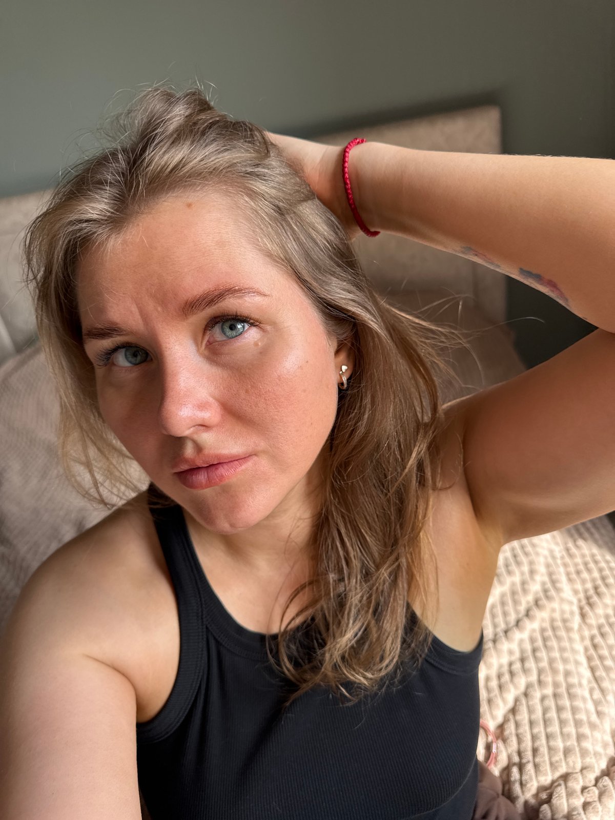 Woman in black tank top observed resting in Ferma