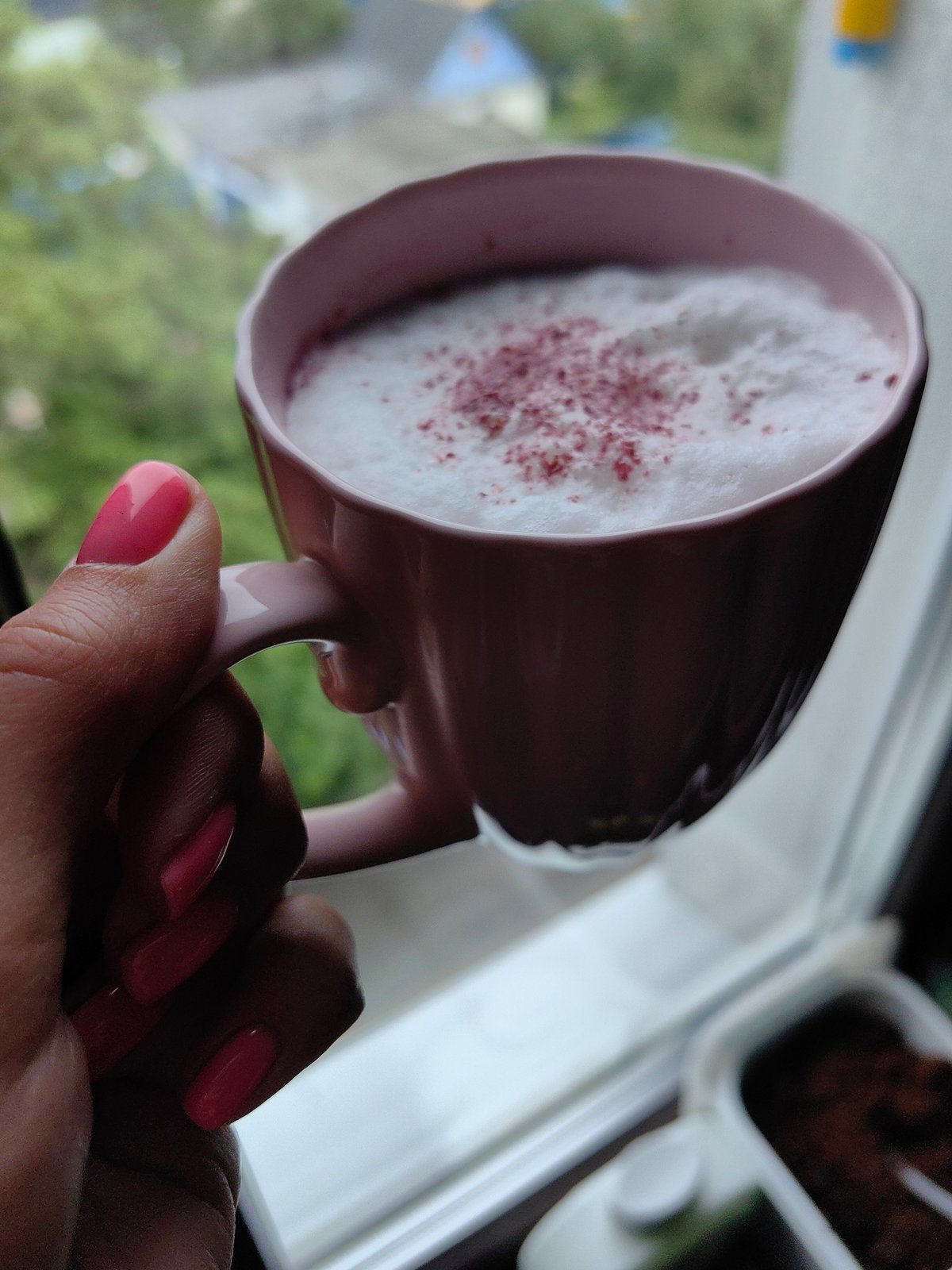 Frothy pink drink and Borjomi water on a Fanipal morning