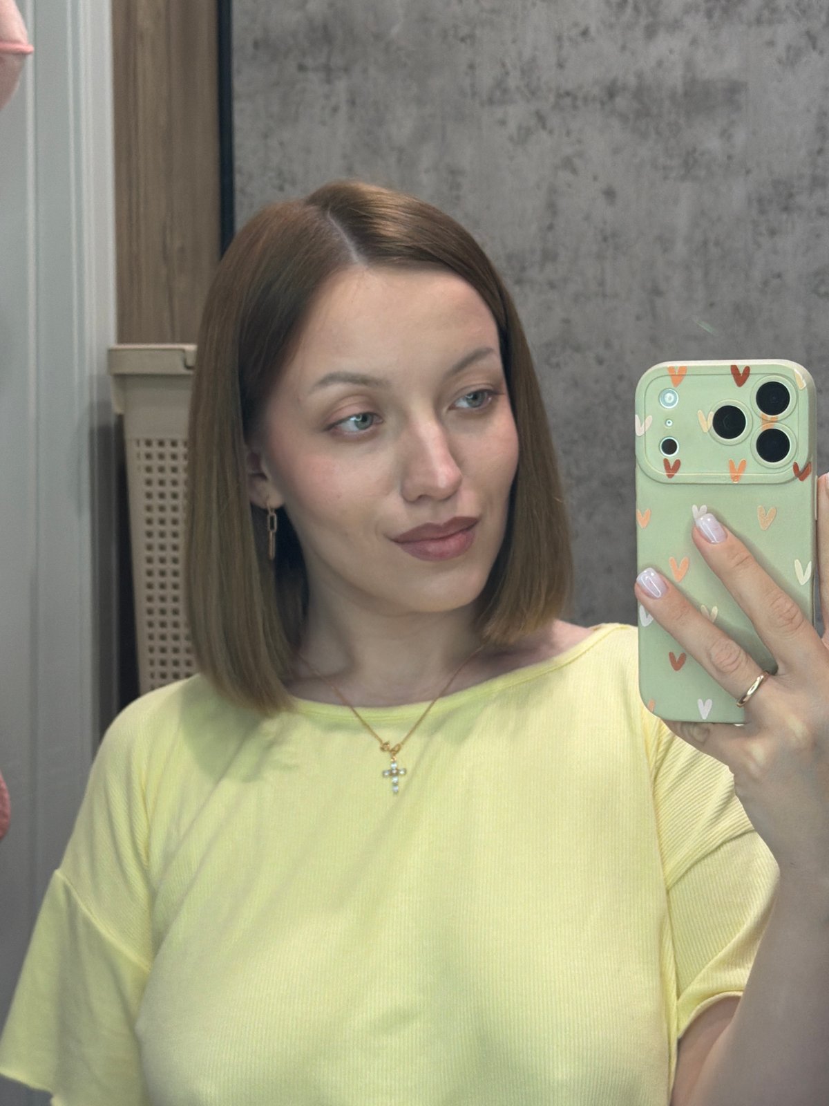 Woman takes selfie with decorated phone in Reshetnikovo