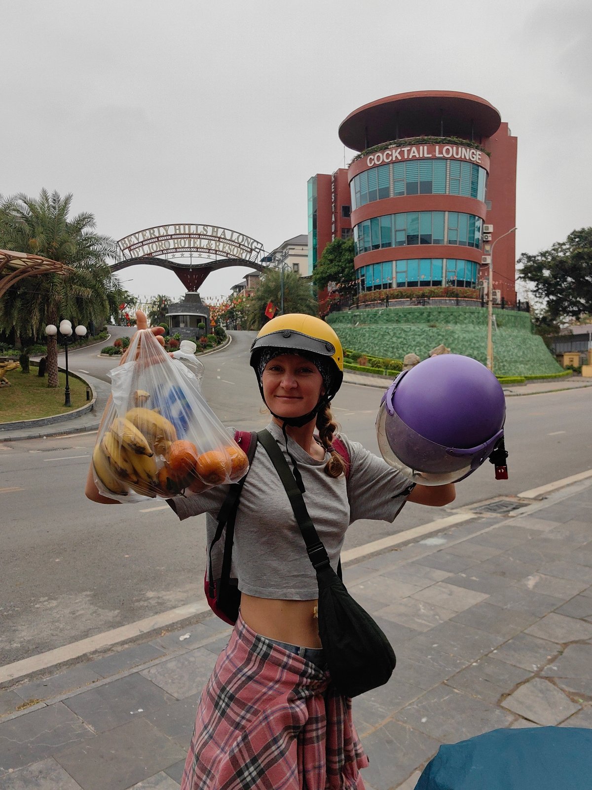 Woman poses playfully on Vietnam sidewalk during early morning