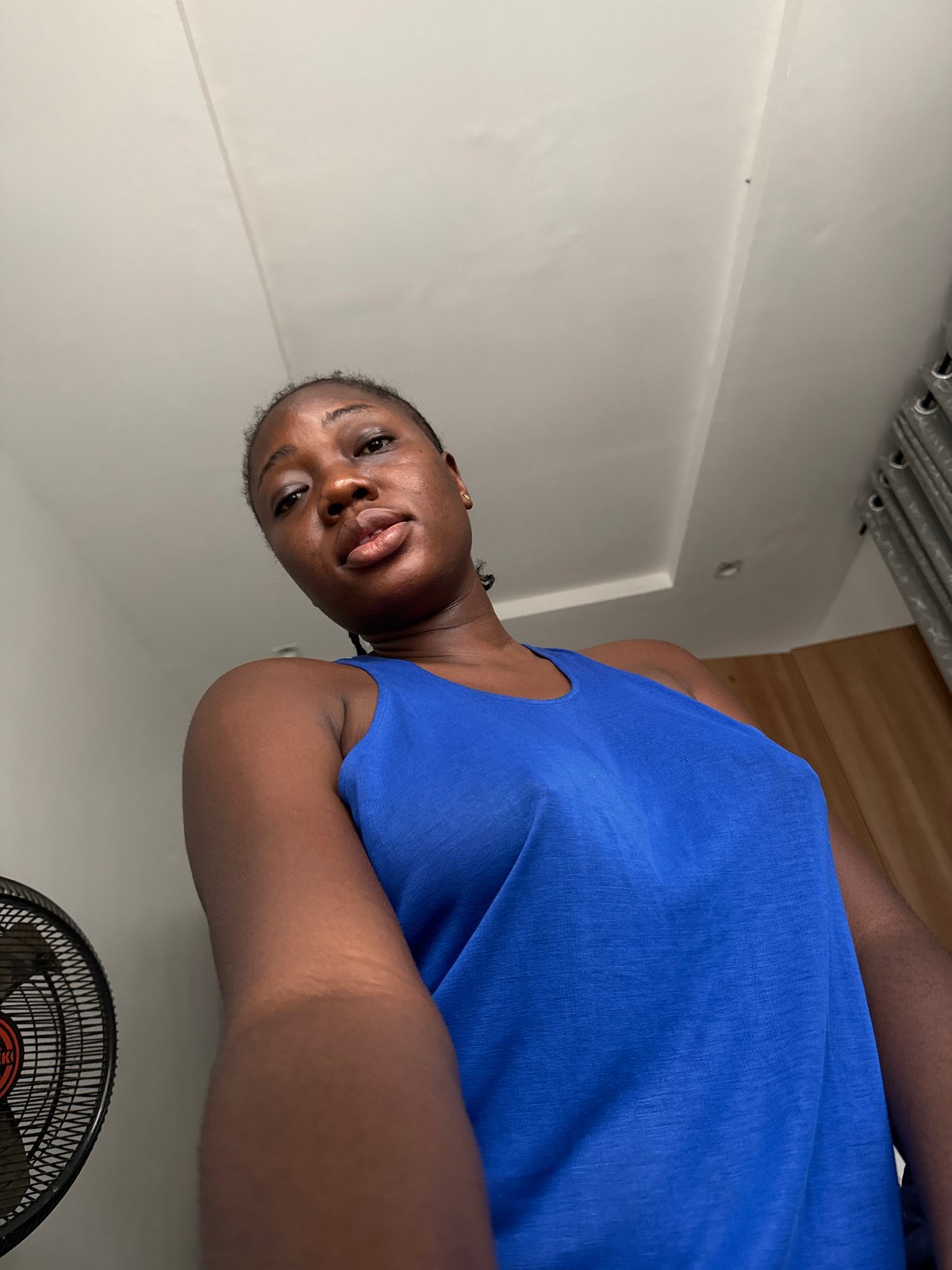 Woman takes morning selfies while drinking Coca-Cola in Nigeria