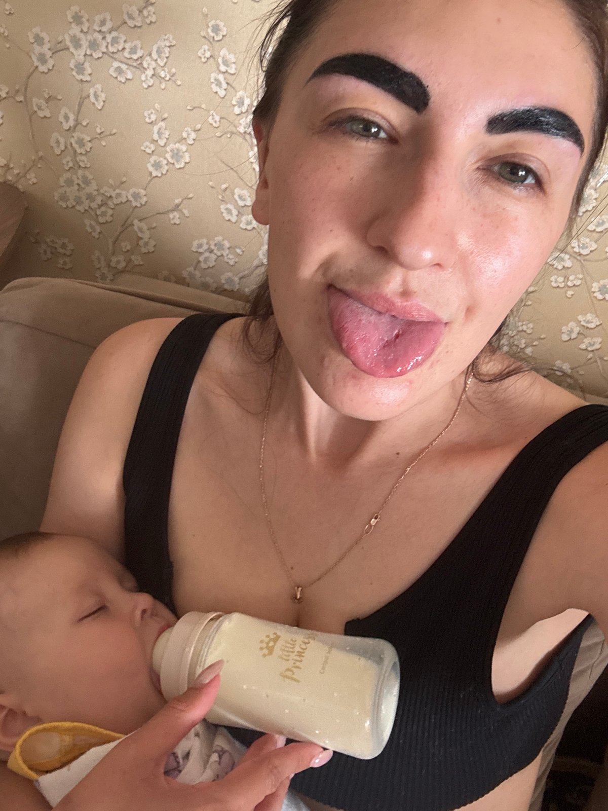 Mother feeds baby, toddler plays in Sochi home