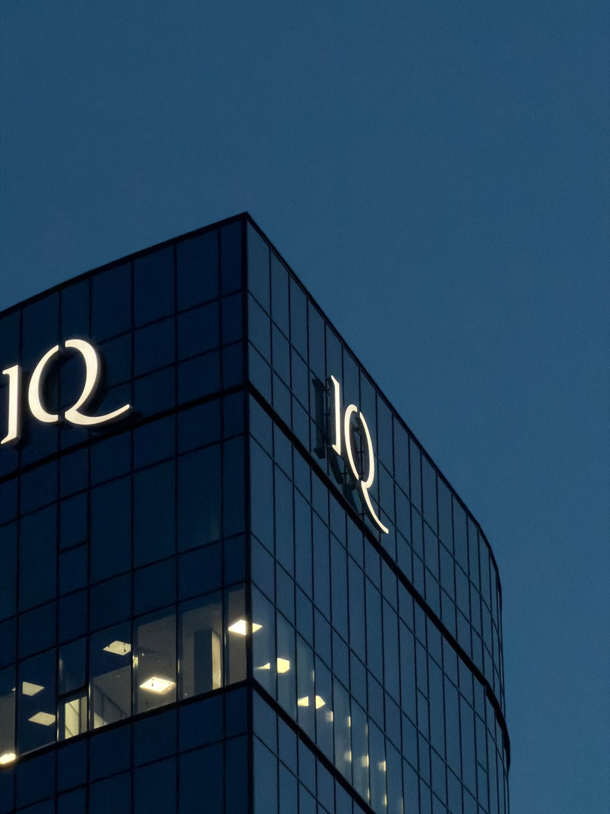 IQ Business Center glows against Brest's twilight sky