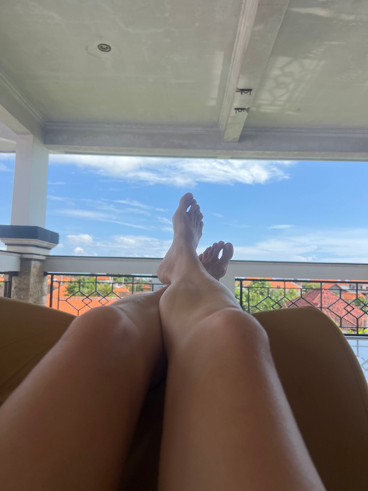 Morning relaxation captured on Canggu balcony with pet