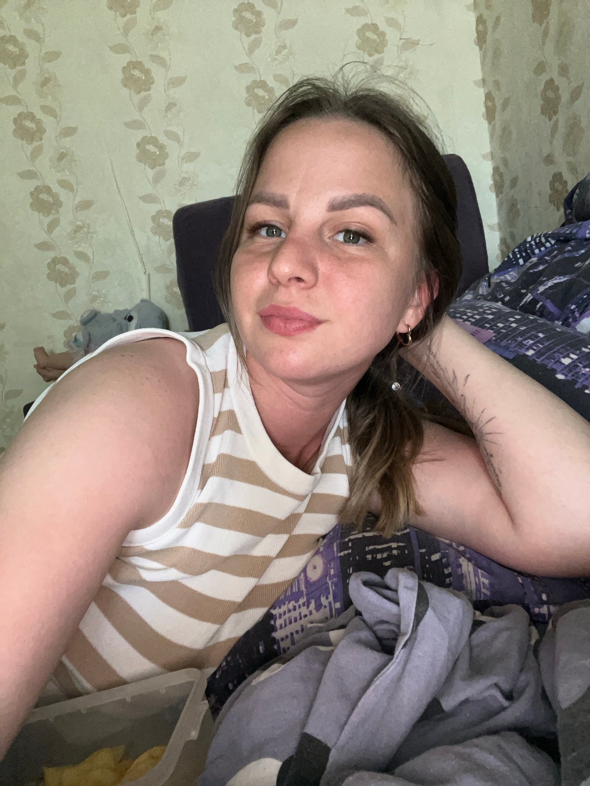 Woman documents lazy morning routine with selfies and snacks