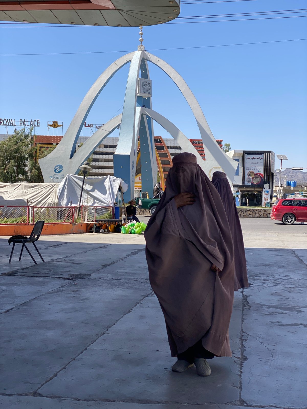 Street life near a Kandahar landmark, July 2026