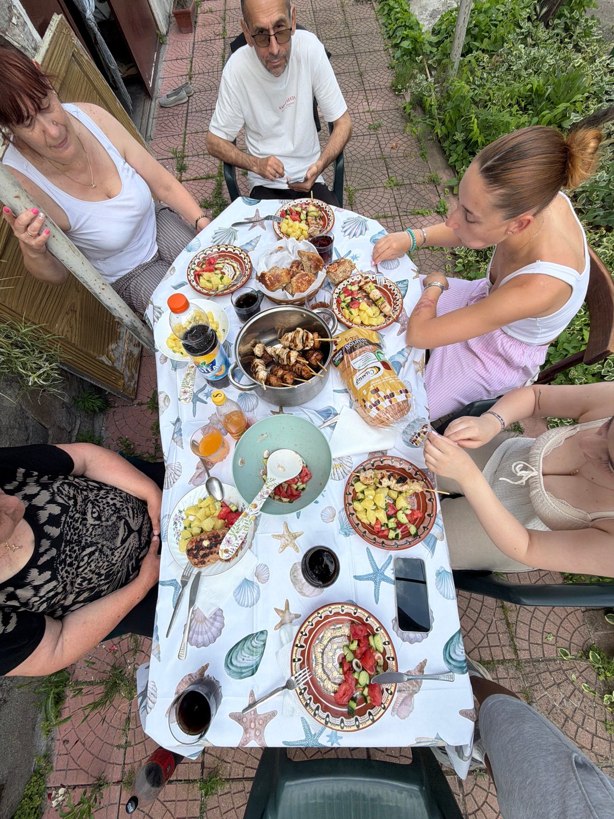 Outdoor lunch gathering of five people in Krumovo, Bulgaria