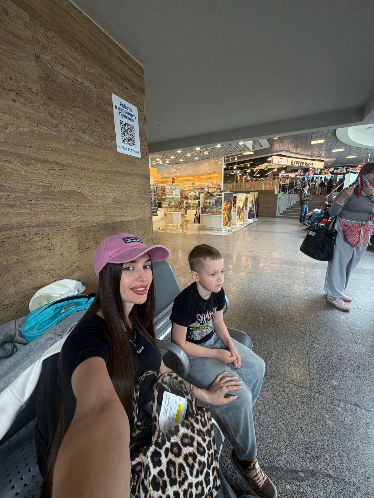 Mother and child travel through Saint Petersburg airport