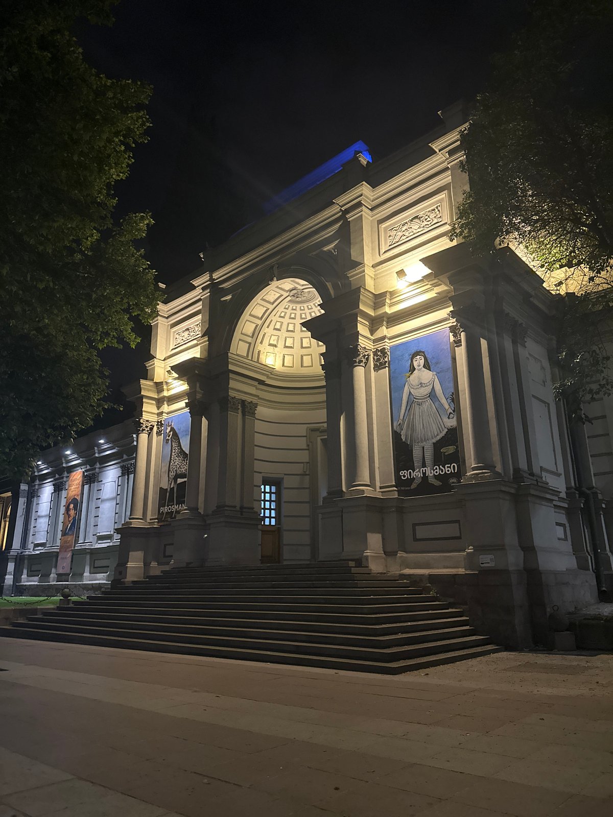 Tbilisi's Art Palace Museum illuminated at night