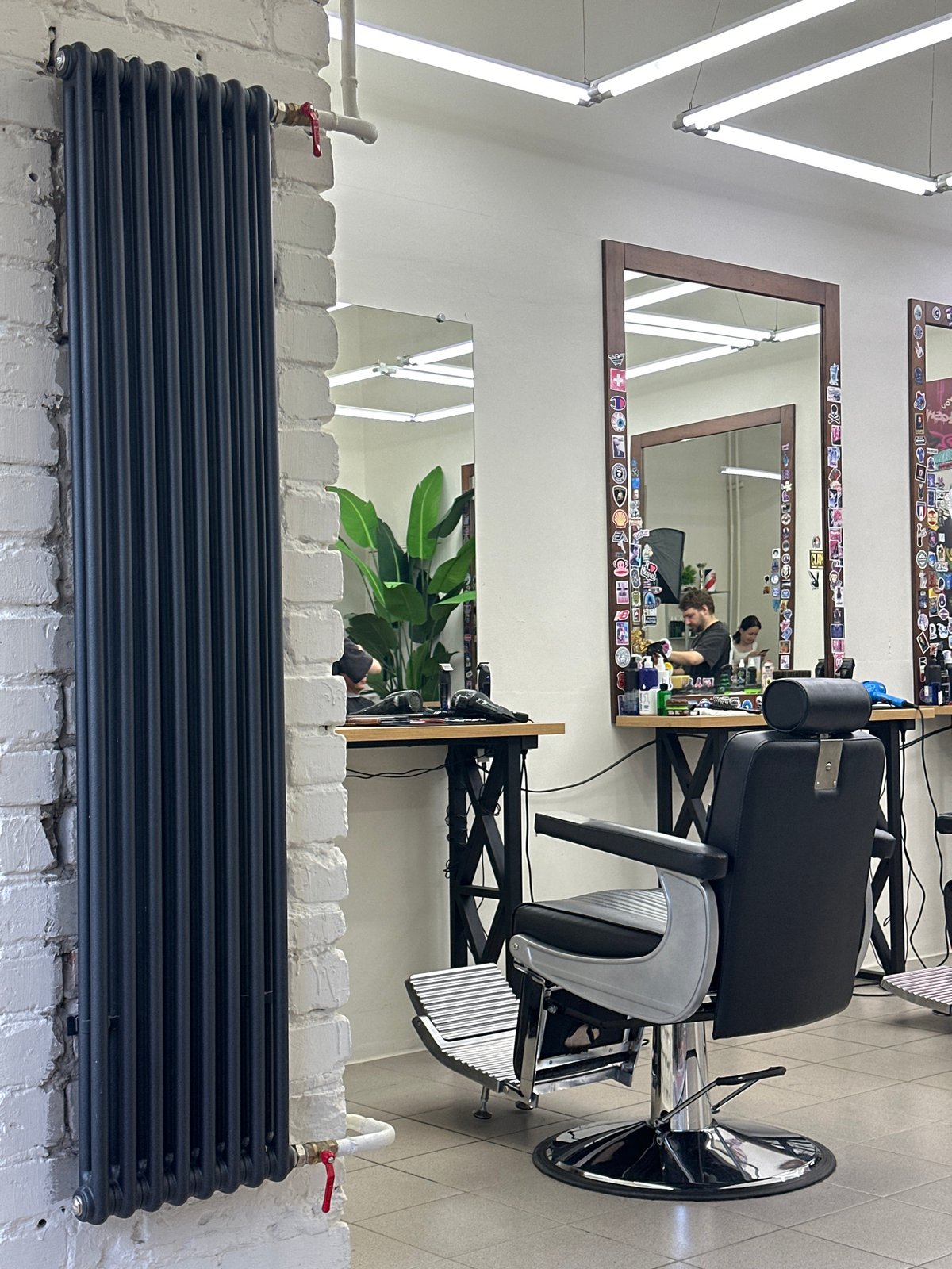 Inside a Chaikovsky barbershop, with glimpses of the street outside