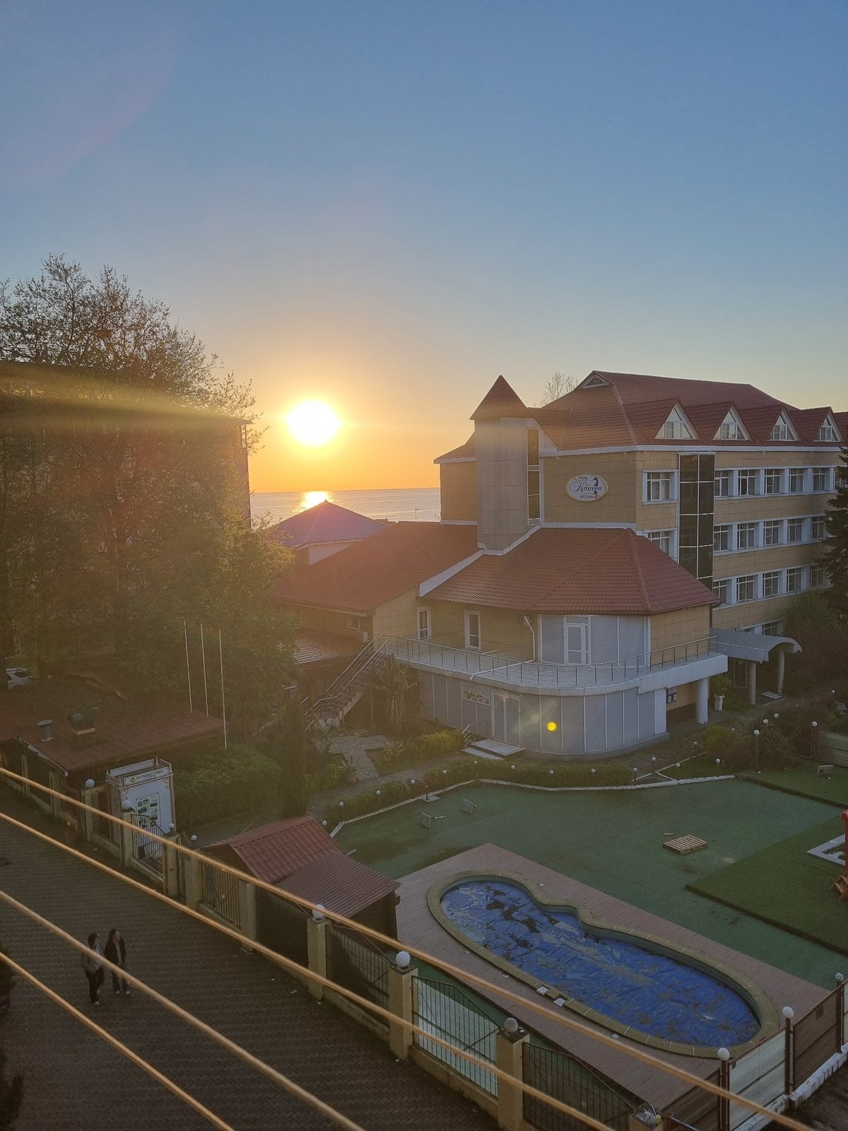 Sunset hotel view and decorative blanket observed in Sochi