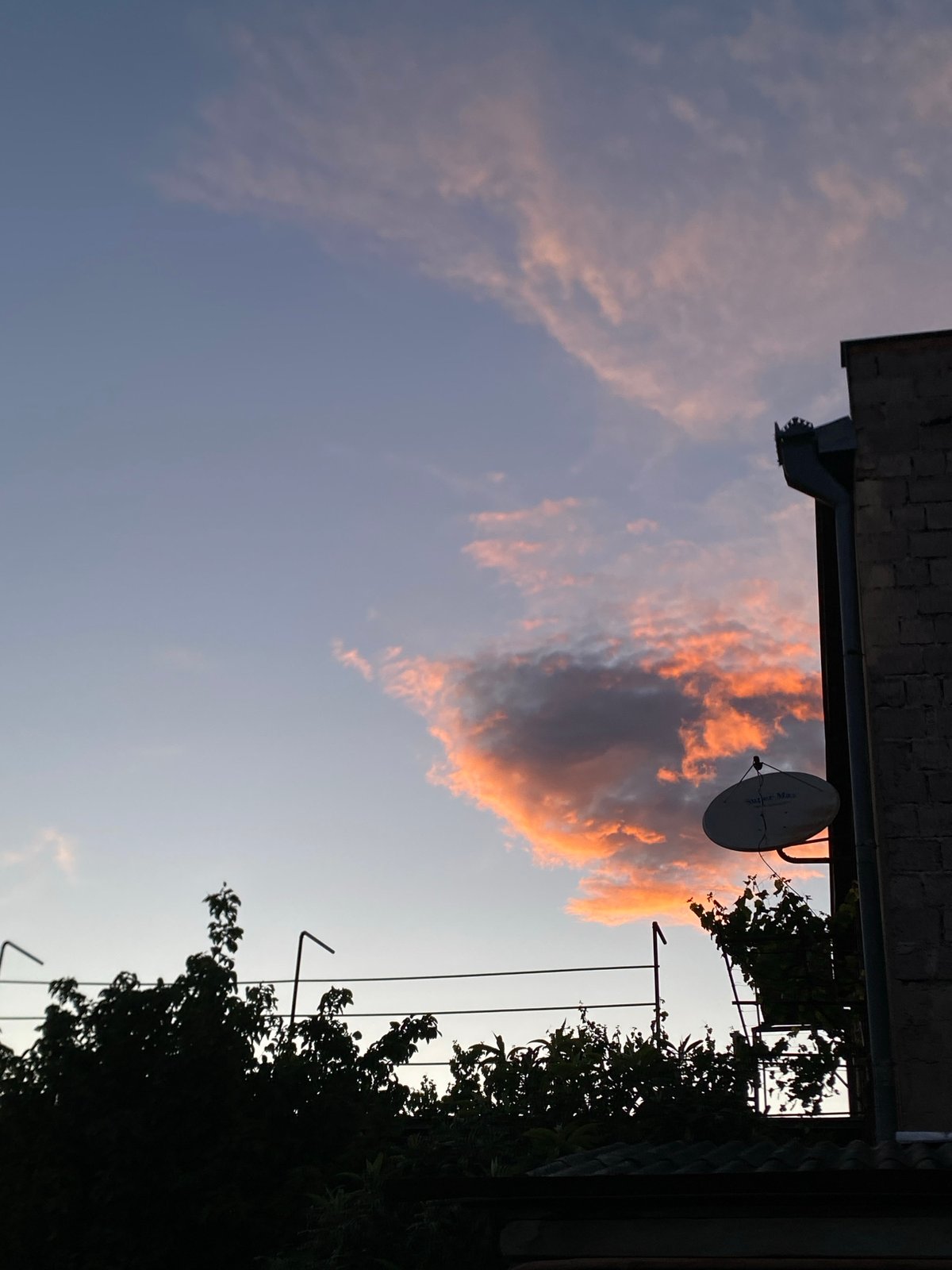 Sunset photographed over residential Tbilisi neighborhood