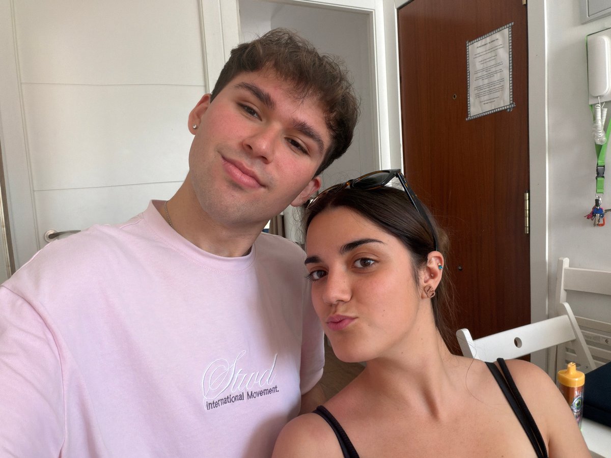 Couple takes casual indoor selfie in Burjassot, Spain