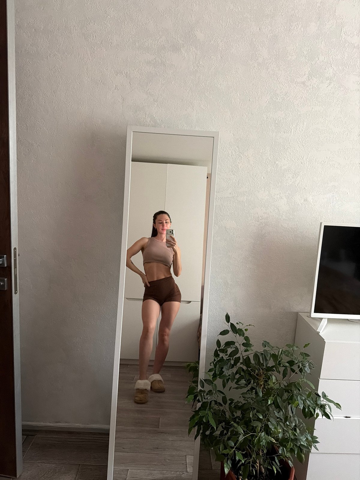 Woman photographed in bed during early morning hours in Perm
