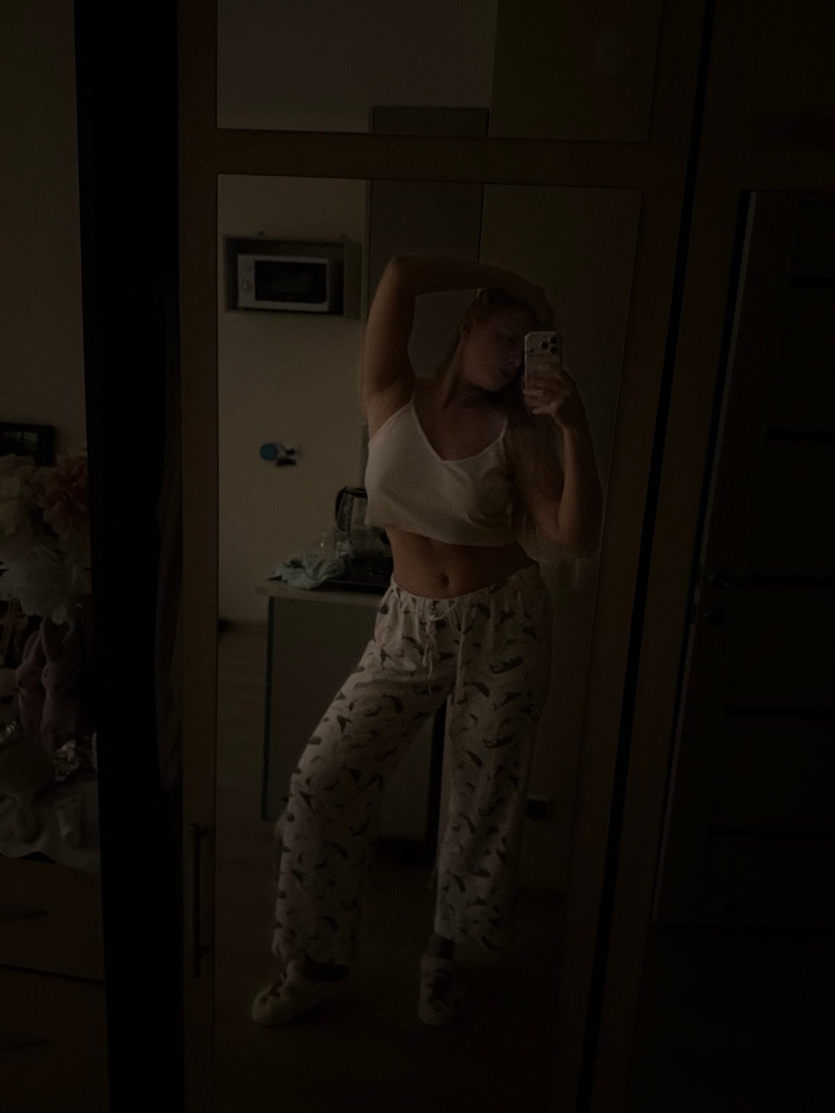 Woman documents evening routine with laptop and selfies in Izhevsk