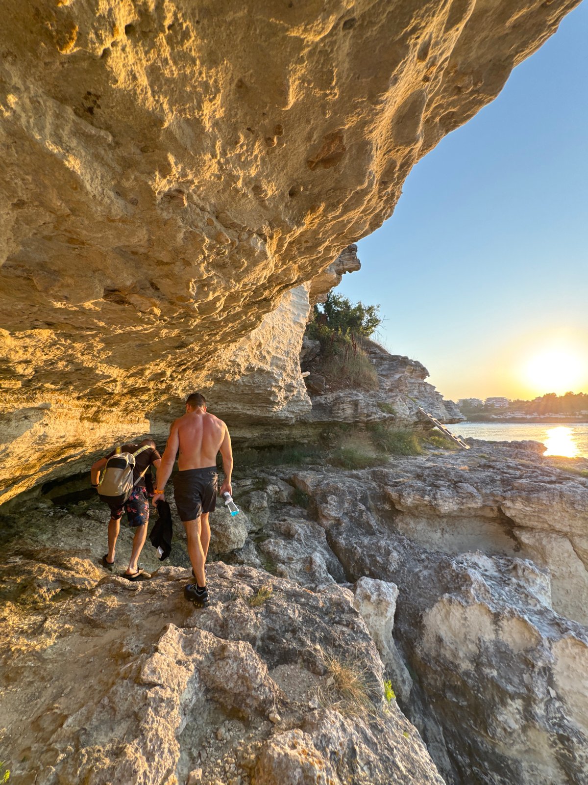 Scrambling up a cliff ladder at sunset on Bulgaria's Black Sea coast