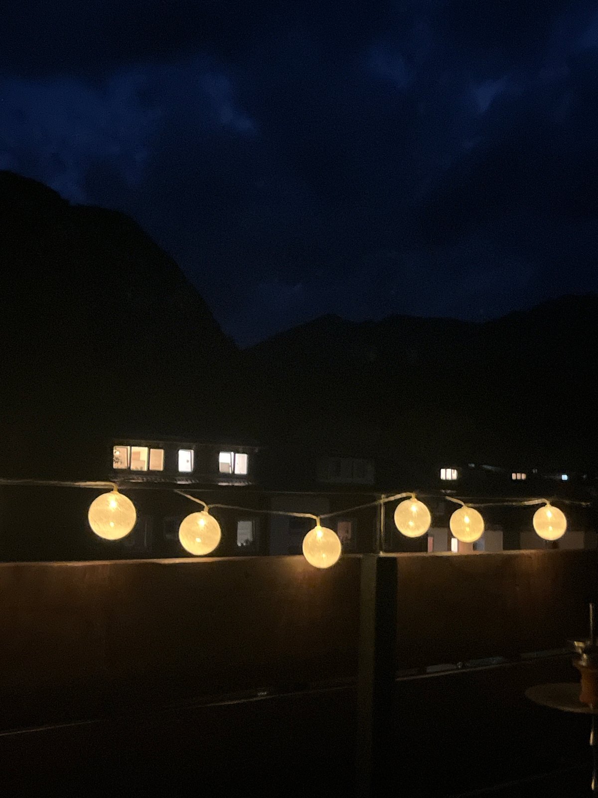 Evening balcony views with string lights in Garmisch-Partenkirchen