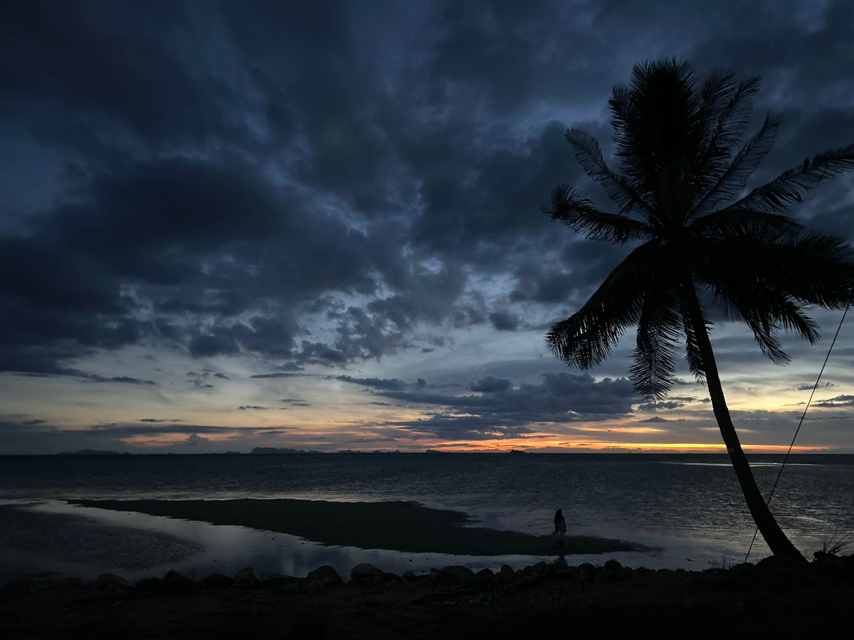 Lone figure photographed at dusk on Ko Phangan beach