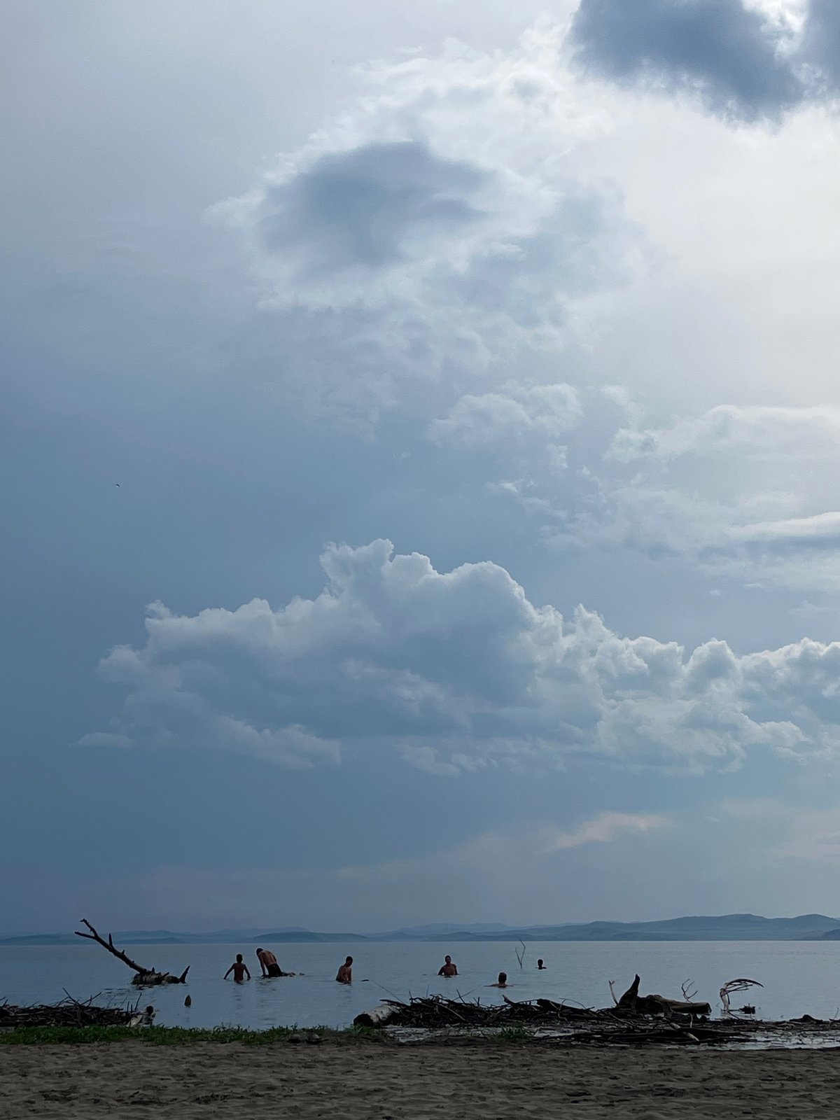 Cloudy summer morning at a lakeside beach in Krasnoturansk