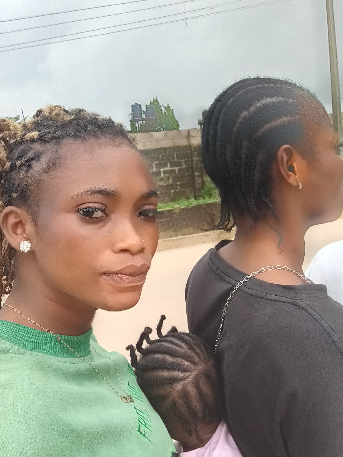 Two women with child observed in Shagamu, Nigeria