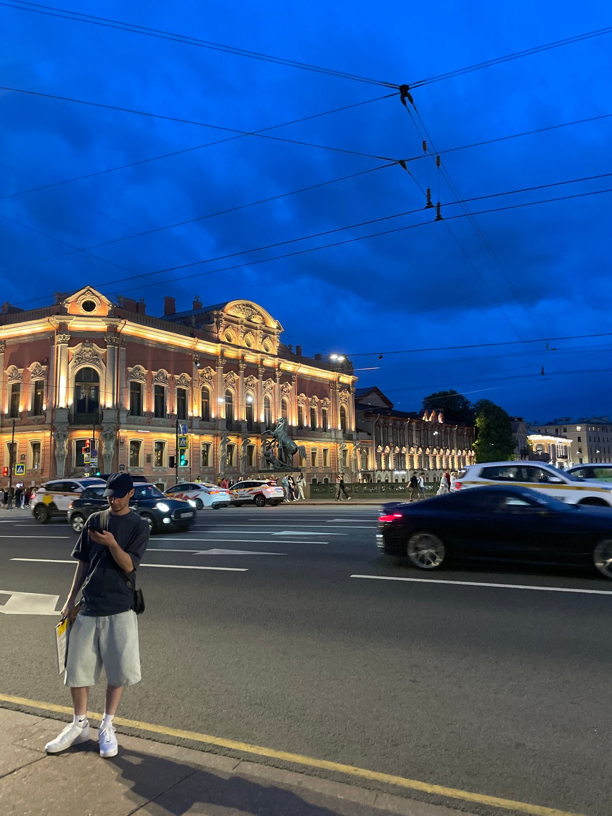 Evening street life documented across central Saint Petersburg during white nights