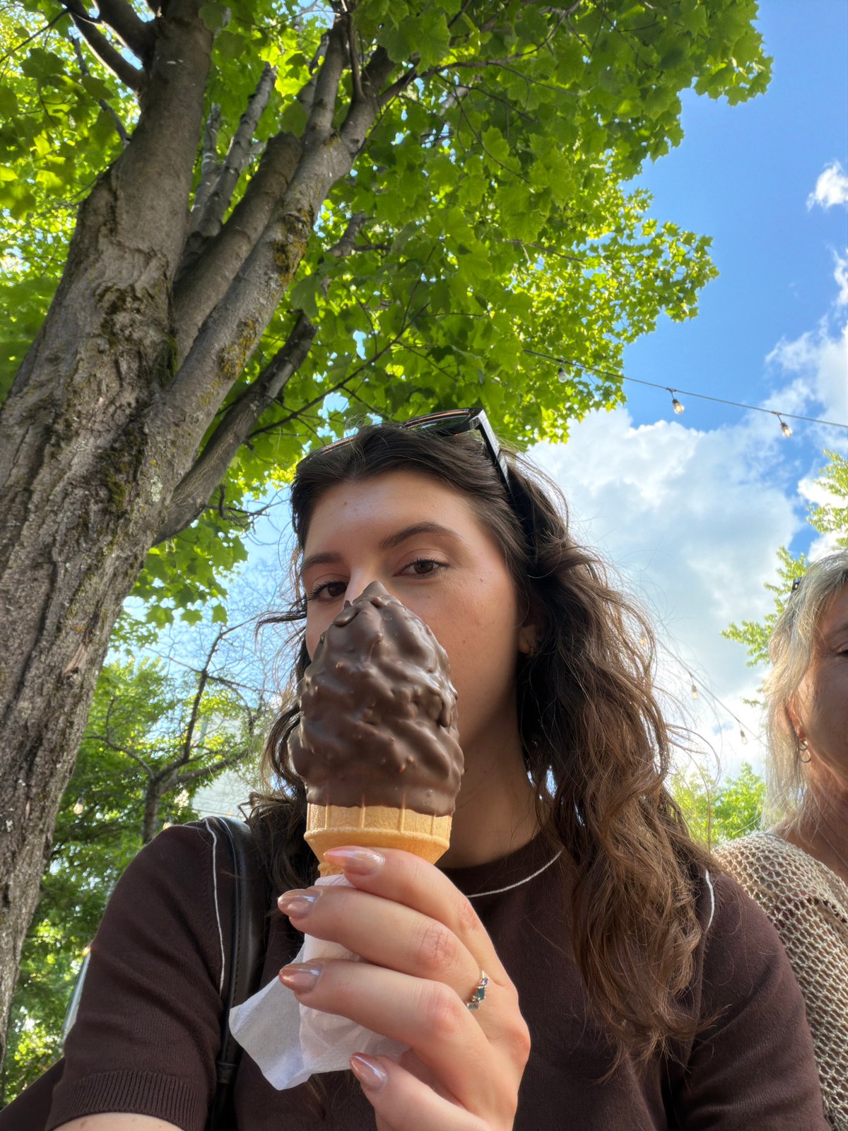 Fresh chocolate-dipped ice cream cone at a Mont-Tremblant shop