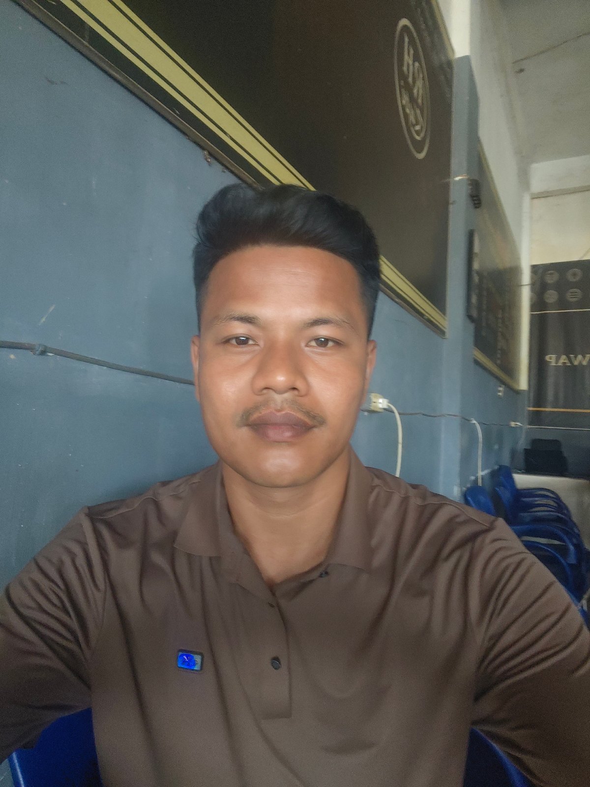 Crypto charts, a blue wall portrait, and a napping kitten in Indonesia